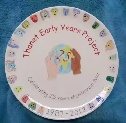 Plate showing design titled 25 years of childcare in 2012
